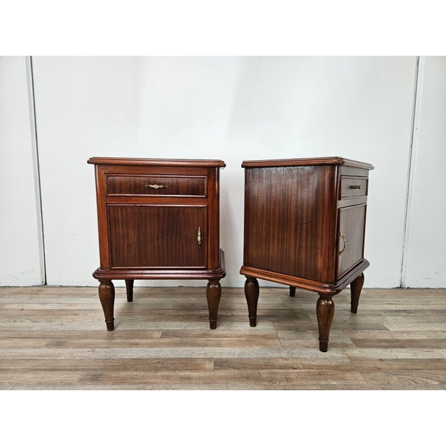 An elegant pair of Italian Art Deco-style nightstands dating back to the 1950s, featuring soft, refined lines that combine...