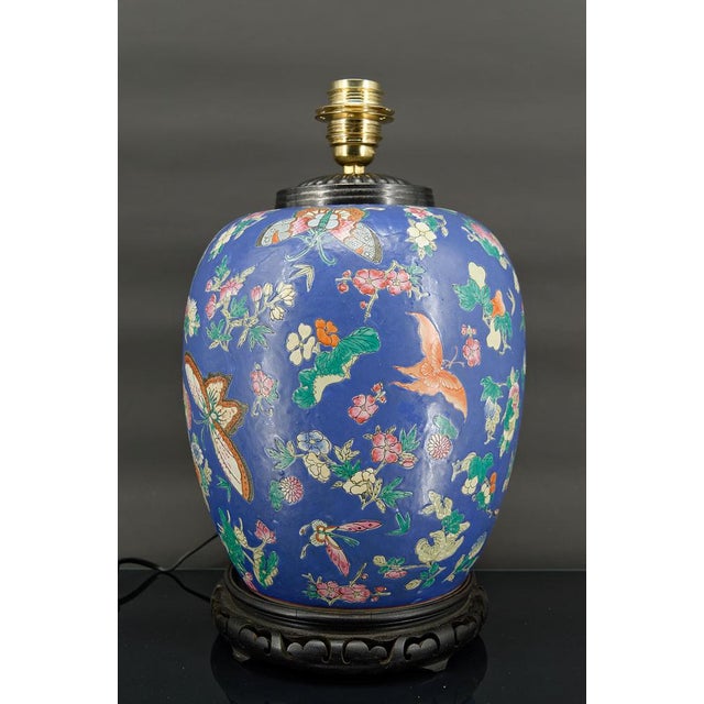 Important Chinese lamp in blue ceramic decorated with butterflies and flowers. China. QING dynasty, Tongzhi era, 1861-1875...