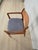 Vintage Danish Modern teak armchair made in Denmark, circa 1960s. This beautifully crafted chair features the sculptural...