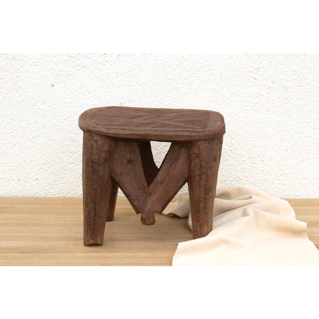 A unique piece of African art, this vintage Nupe table from Nigeria is a must-have for collectors and enthusiasts of Nupe...