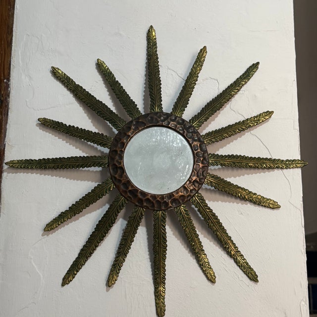 Magnificent bronze sunburst mirror from the 1950s. Two-tone. French craftsmanship.