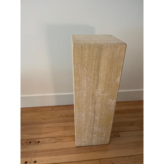 Groovy travertine pedestal to display your fleurs or favorite sculpture.