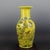 Expertly crafted during the Qing Dynasty, this Chinese Ceramic Vase features a Qianlong mark and striking yellow ground...