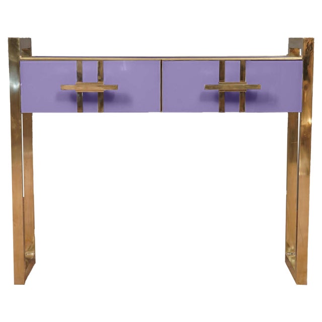 Modern Italian console table in purple Murano glass and brass, handcrafted to order. The solid wood frame is covered in...