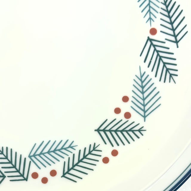 White holiday ceramic platter. This stunning large white ceramic platter featuring a holly and berries design is by Dansk...