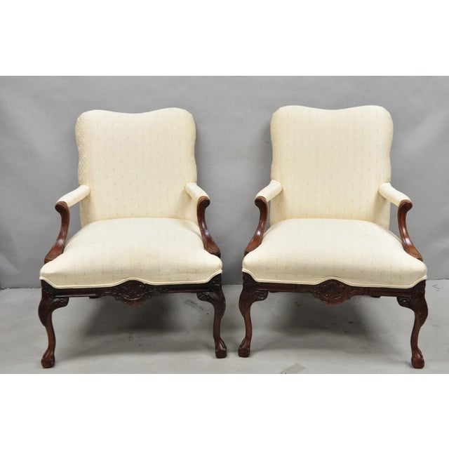 Vintage Thomasville Georgian Style Carved Mahogany Library Lounge Arm Chairs - a Pair. Chairs feature carved ball and claw...