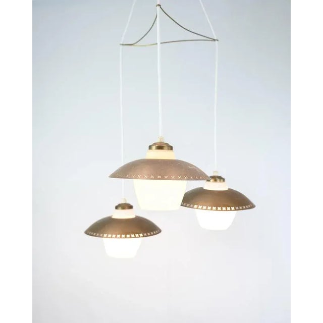 Ceiling lamp by Bent Karlby from the 1950/60s with three pendants in opal glass and brass. Designer: Bent Karlby Period:...