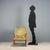 This 1960s armchair with exposed beech wood armrests is a distinctive example of mid-century design. The wooden frame...