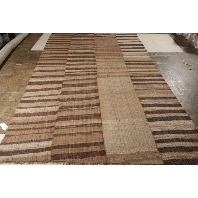 This 9x17 vintage Persian rug is a particularly gorgeous Kilim of Mazandaran provenance—an oversized piece among few of...