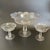 This open compote set includes one large comport and two smaller ones. Each piece features a softly flared and ruffled...