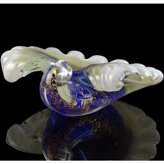 Beautiful vintage Murano hand blown blue, white and gold flecks art glass seashell bowl / sculpture. Created in the manner...