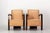 A pair of Art Deco armchairs dating from the 1930s. Their structure features the geometric lines characteristic of this...