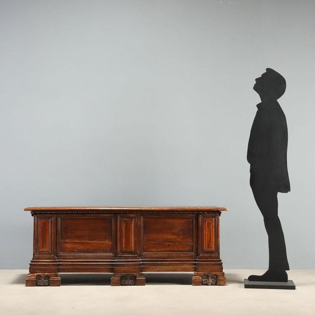 18th-century Baroque walnut chest from Italy, featuring a bipartite front with three slightly protruding uprights. The...