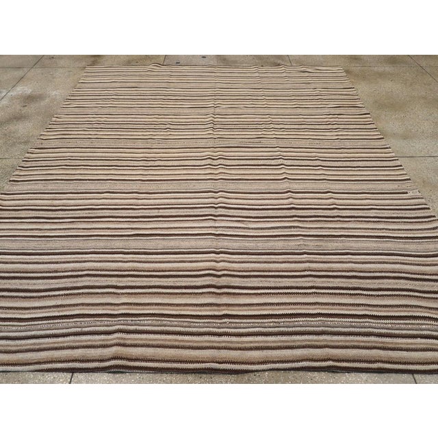 A vintage Turkish flatweave Kilim room size carpet handmade during the mid-20th century. Measures: 9' 2" x 11' 0"