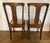 Beautiful pair of vintage oak dining chairs, professionally refinished by Hilaire Furniture. These chairs feature...