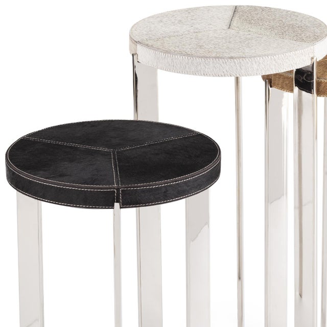 Andres natural hair on hide mixer tables are the perfect accent to any room. The metal frame gives a rustic feel while...