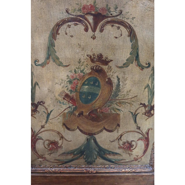 A Louis XVI three-panel screen, late 18th century. The frame is giltwood, and the oil paintings on canvas depict gallant...