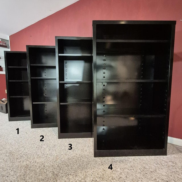 This is a set of 4 vintage midcentury modern tanker style steel bookcases with original black powder coating. They were...