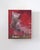 In "Memoriam," a solitary knight's helmet sits against a vibrant red backdrop, evoking a sense of nostalgia and...
