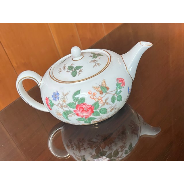 Vintage Wedgwood bone china teapot in the Charnwood pattern (WD 3984) featuring a floral and butterfly design with gold...