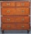 A handsome British military officer’s Campaign Ware chest of drawers or dresser, from the 19th century, featuring a...