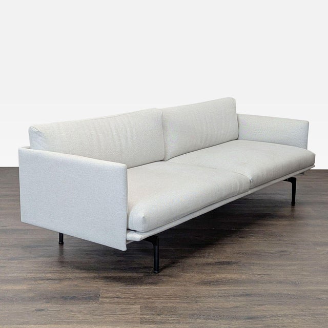 Clean and simple, this Design Within Reach - Muuto 3-seat sofa features a light fabric and slim black legs. Its spacious...