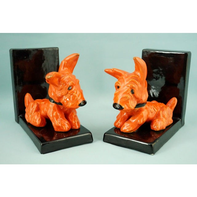 MEASUREMENTS: Dog 1: Height: 13.7 cm; Width: 11 cm; Depth: 15 cm Dog 2: Height: 13.4 cm; Width: 8.3 cm; Depth: 14.8 cm...