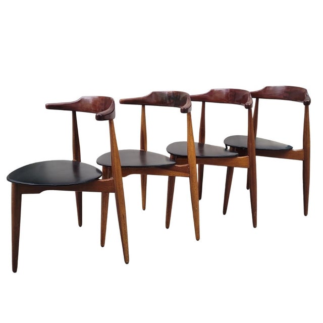 Exquisite dining set with a round extendable table and four teak chairs, closely following the design of Hans Olsen's...