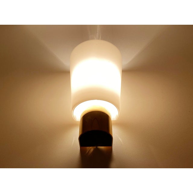 Set of 3 Vintage Limburg sconces, featuring a gilded brass base, conical shaped glass shades. Very good condition...