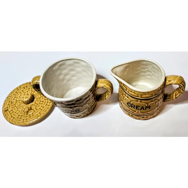 This adorable cream and sugar set is fully functional with no crazing, chips or cracks. The vintage basket design is pure...