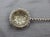 Sterling silver sifting ladle, Sheffield, England, 1894. Fun East Midlands Imp adorns the tip. Twisted handle (folklore...