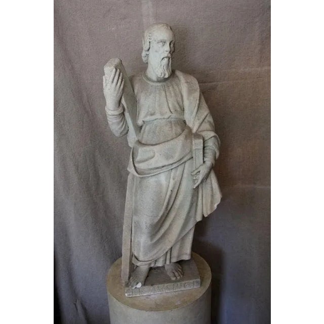 Fine, hand-carved, Carrara marble, robed figure from central Italy modeled in the Classical, contrapposto pose. The...