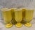 Set of 6 vintage yellow glazed ceramic goblets featuring a slight fluted bowl and rounded knob pedestal stem. Glasses have...