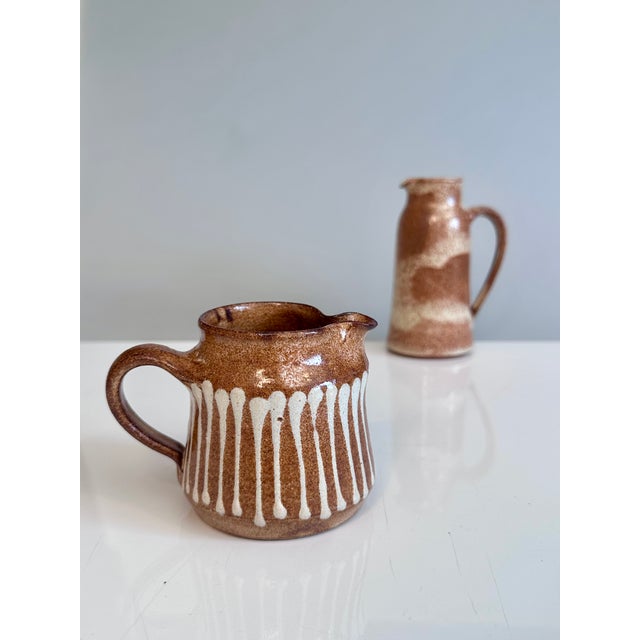 This pair of hand-thrown jugs by the ceramicist Helma Klett (1908-1996) showcases two of her characteristic decorative...