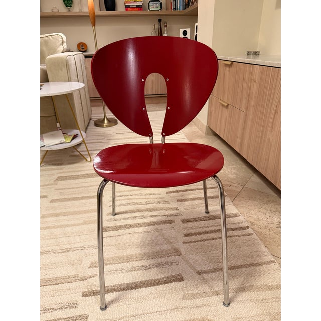 The backrest and seat of the Globus Chair (1994) are made from beech plywood or plastic, with a gently curved back for...