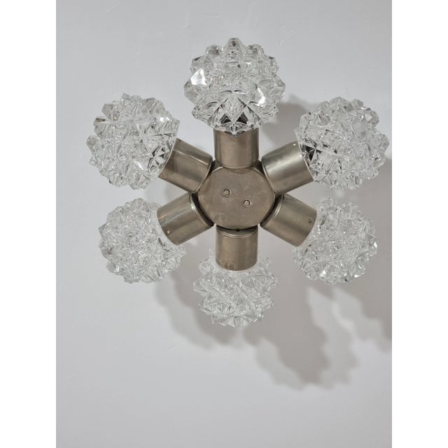 Chandelier in Cut Glass from Kamenický Šenov, in Good conditions. Designed 1970 to 1979 This piece is attributed to the...