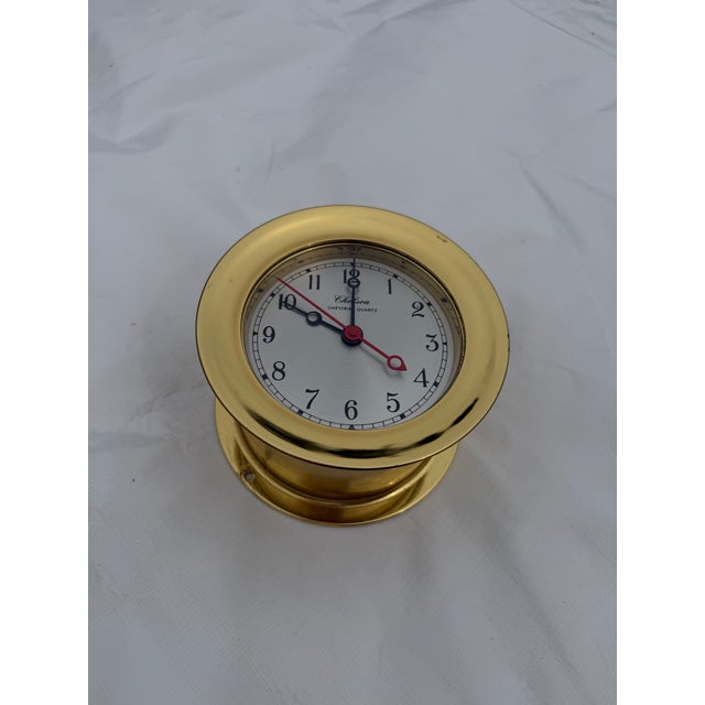This listing is for a polished brass, heavy wall porthole ship-strike clock by Chelsea. The clock is in working order as...