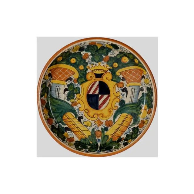 Hand painted Platter featuring a coat of arms II motif with columns and a distressed finish in shades of red blue and...