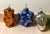 Mid-Century Kugel Style Molded Glass Ornaments, circa 1950s–1970s. Two golden / orange owls, a green fir tree, a cobalt...
