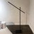 Hashi Flexible Floor Lamp by Davide Groppi with a matte black metal flexible and 3000K led integrated lights and dimmer....