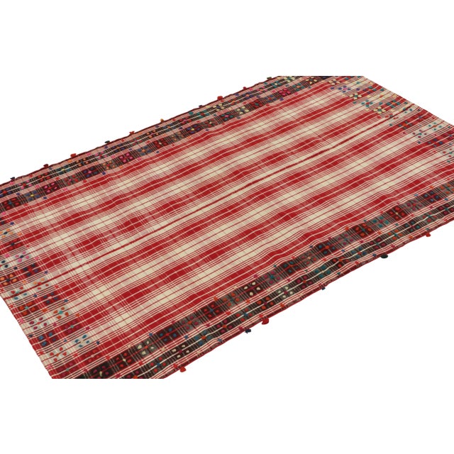 This vintage 5x8 Kilim is believed to be a tribal rug of the 1950s. Handwoven in wool, its design reflects a tribal panel...