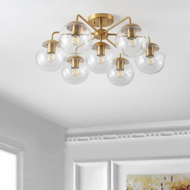 Elevate your space with the elegant Camdyn 7 light flush mount. With its stunning 25 inch diameter, this fixture offers...