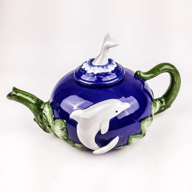 Beautiful colors on this little pot. We love the dolphin tail as the handle and the overall theme. Quirky but a...