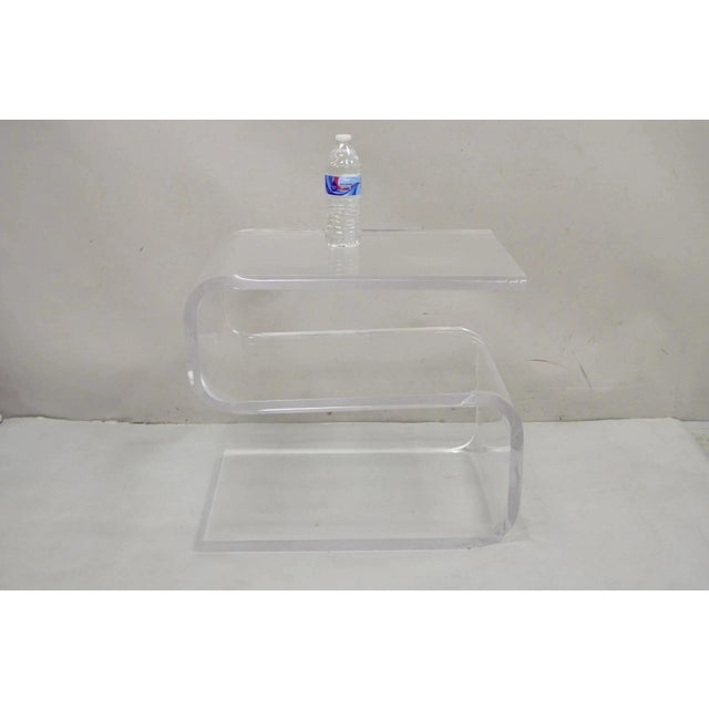 Vintage Mid Century Modern Clear Lucite Sculptural "S" Form" 3 Tier Side Table. Item features thick heavy lucite...