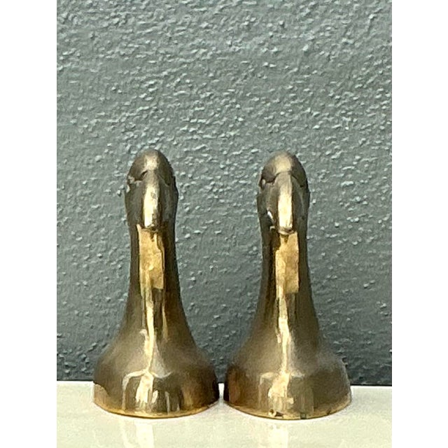 These striking vintage bookends are a quintessential example of Hollywood Regency style, featuring bold, sculptural eagle...