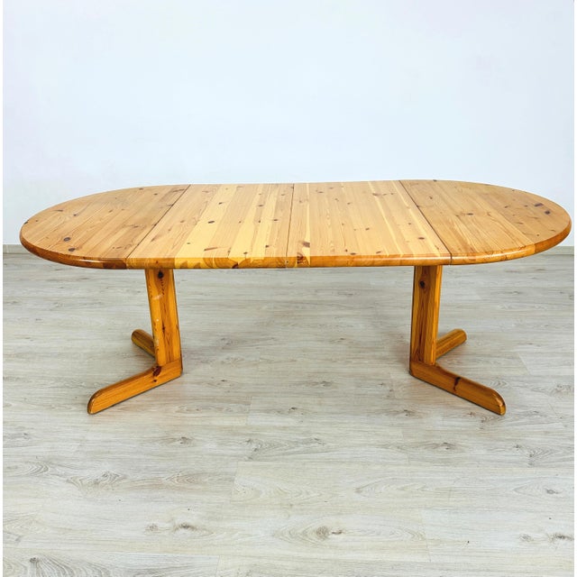 Dimensions: H 29.5” x W 41.5” Extended: W 81.7” Vintage Danish extendable solid pine dining table manner of Rainer...