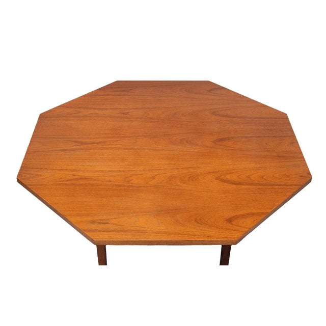 Very nice octangle shaped dining table . Solid Teak Wood legs . 1960s . the legs are detachable . Good condition.