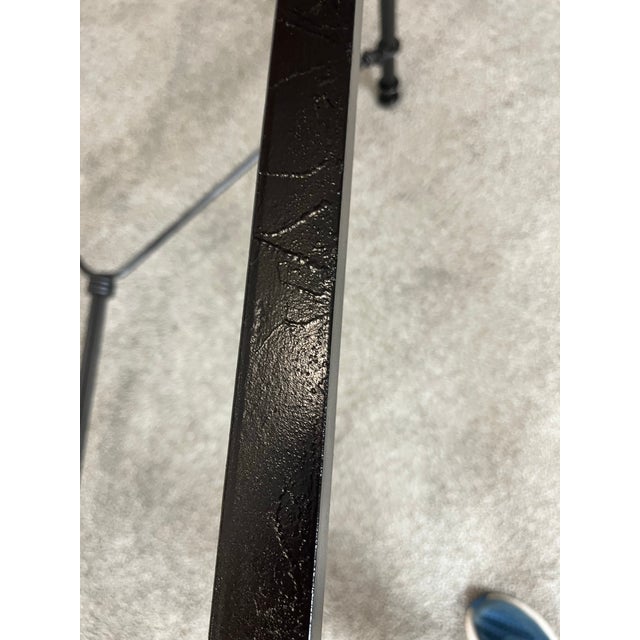 Classically designed after Giacometti hammered finish black wrought iron dining table. I’m guessing 1970’s is when this...