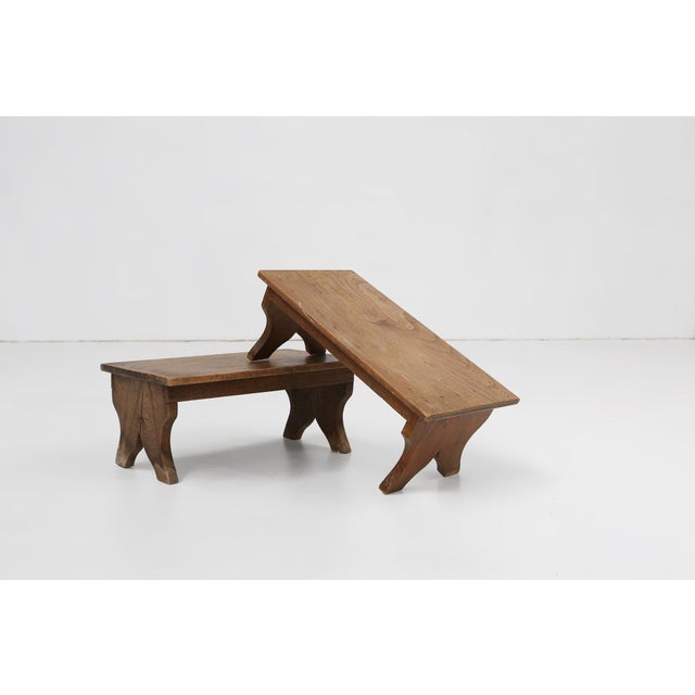 A charming example of rural French craftsmanship, this early 20th‑century wooden stool embodies the simplicity and...
