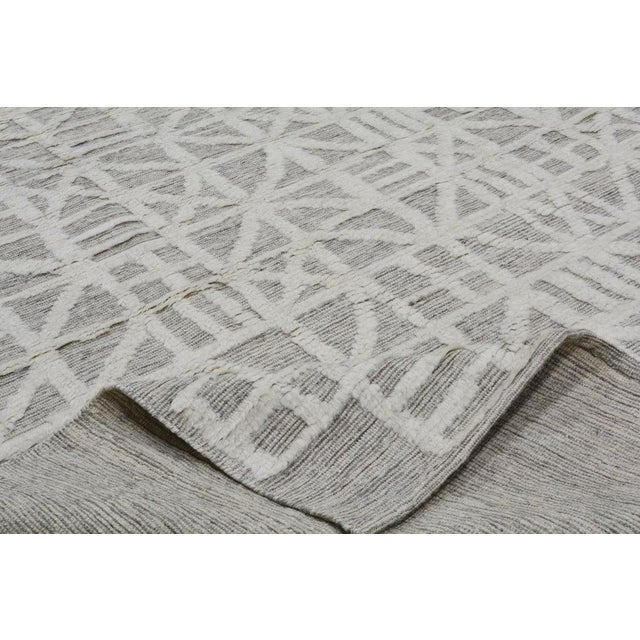 Moroccan Azilal hand knotted wool rug with soft texture.